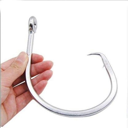 Large 28/0 stainless steel shark fishing circle hook held in hand, designed for big game saltwater fishing