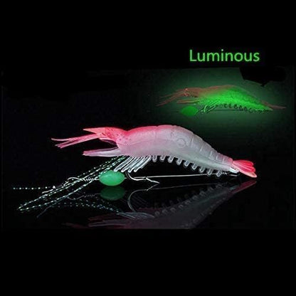 Pink luminous shrimp lure showing glow effect for night fishing