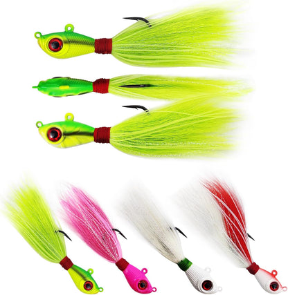 Three chartreuse bucktail jigs with red hooks and glowing heads for snook, redfish, and tarpon fishing