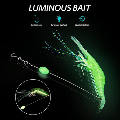 Glowing luminous shrimp fishing lure with barbed hook, glow bead, and flasher strands for precision night fishing targeting snook, redfish, and tarpon